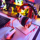 Gaming headphones and mouse on a desk